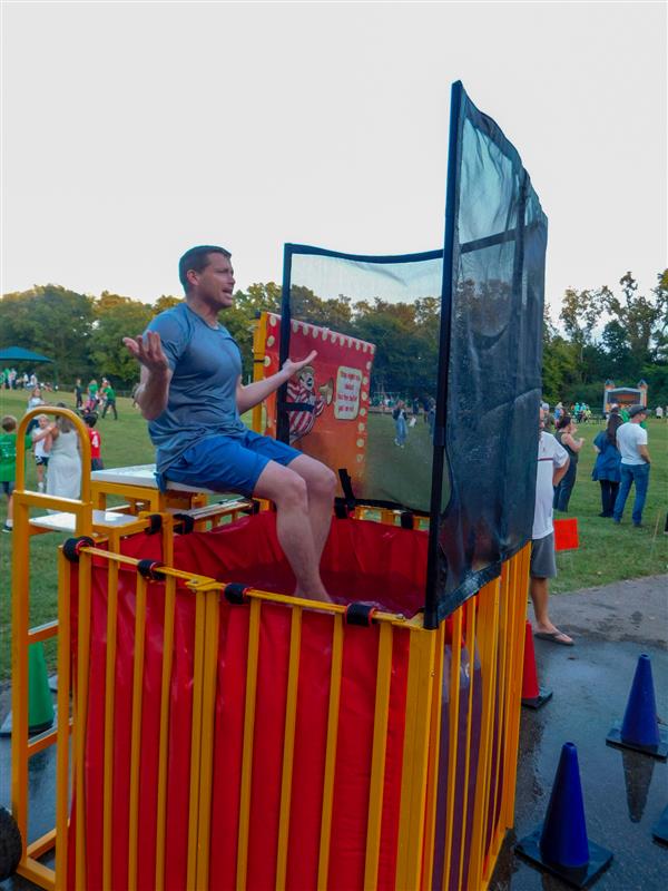 Students outside enjoying a family fun night for their school.